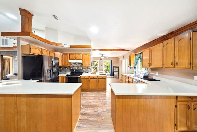 3512 W Whippoorwill St, Lecanto, FL 34461 - kitchen featuring black fridge, electric stove, lofted ceiling, and a peninsula