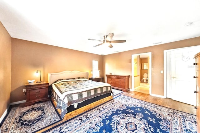 3512 W Whippoorwill St, Lecanto, FL 34461 - bedroom featuring wood finished floors, a ceiling fan, and ensuite bathroom