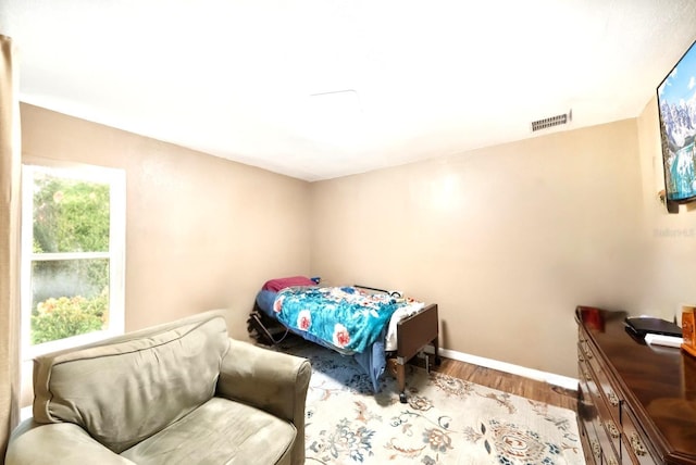 3512 W Whippoorwill St, Lecanto, FL 34461 - bedroom featuring wood finished floors and baseboards