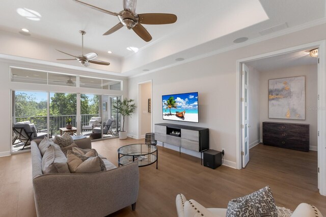 8035 St Simons St Unit 8035, University Park, FL 34201 - living room with baseboards, a ceiling fan, a tray ceiling, and wood finished floors