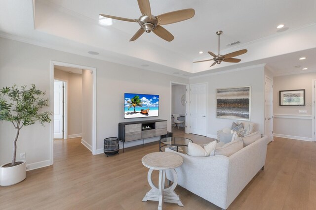 8035 St Simons St Unit 8035, University Park, FL 34201 - living area featuring a tray ceiling, light wood-type flooring, a ceiling fan, and visible vents