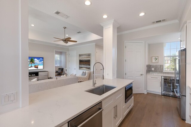 8035 St Simons St Unit 8035, University Park, FL 34201 - kitchen with a sink, visible vents, wine cooler, and stainless steel appliances