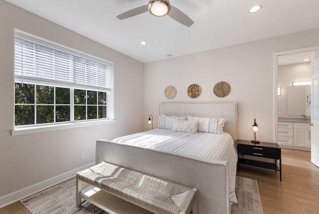8035 St Simons St Unit 8035, University Park, FL 34201 - bedroom with baseboards, ceiling fan, light wood-type flooring, recessed lighting, and connected bathroom
