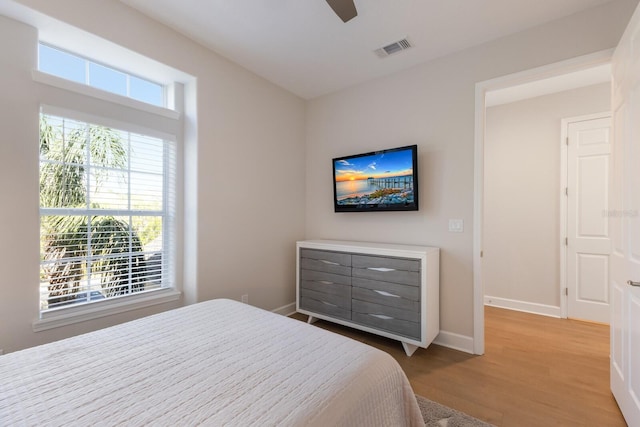 8035 St Simons St Unit 8035, University Park, FL 34201 - bedroom featuring ceiling fan, baseboards, wood finished floors, and visible vents