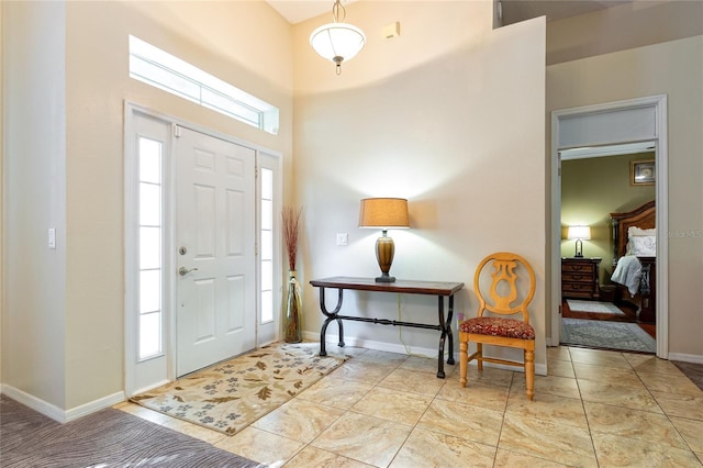 3509 Battersea Ct, Belle Isle, FL 32812 - entrance foyer featuring baseboards and a high ceiling