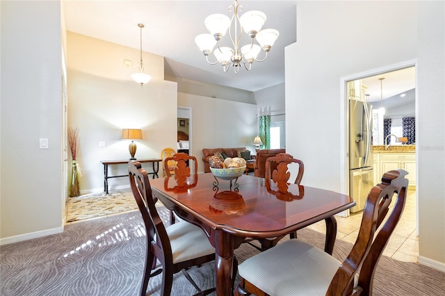 3509 Battersea Ct, Belle Isle, FL 32812 - dining space featuring a chandelier, baseboards, and light carpet