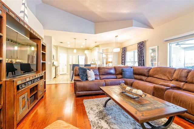 3509 Battersea Ct, Belle Isle, FL 32812 - living area with wood-type flooring, lofted ceiling, and recessed lighting