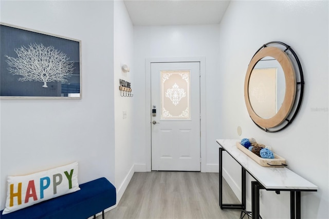 7803 Laurel Oak Ln, Kissimmee, FL 34747 - doorway with baseboards and light wood-type flooring