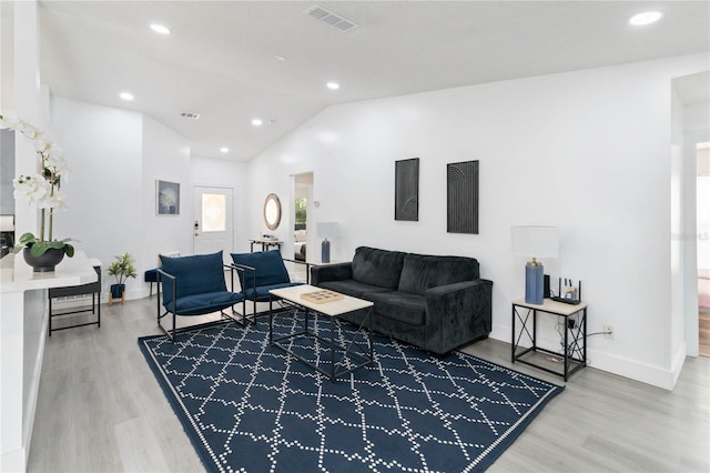 7803 Laurel Oak Ln, Kissimmee, FL 34747 - living area with visible vents, recessed lighting, wood finished floors, and vaulted ceiling
