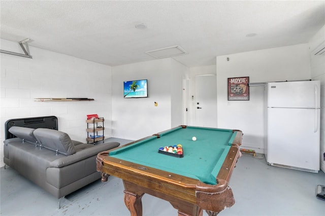 7803 Laurel Oak Ln, Kissimmee, FL 34747 - recreation room with finished concrete floors, attic access, billiards, and a textured ceiling
