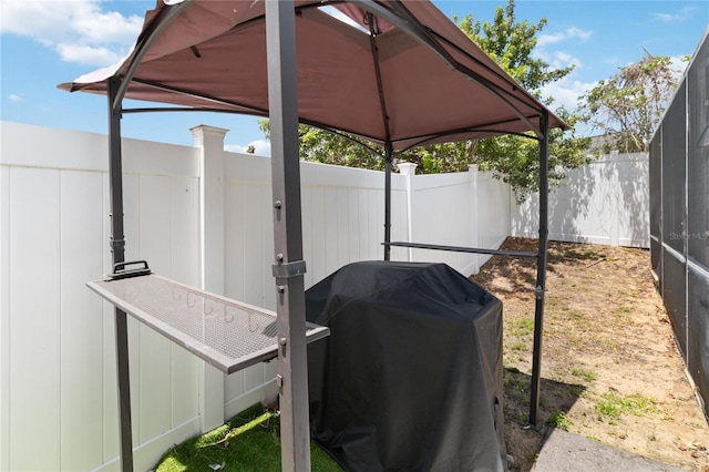 7803 Laurel Oak Ln, Kissimmee, FL 34747 - view of patio featuring a gazebo, fence, and a grill