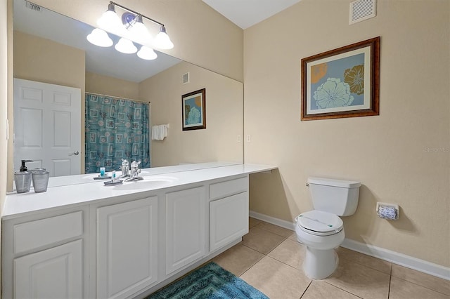 bathroom featuring toilet, tile patterned floors, visible vents, and baseboards