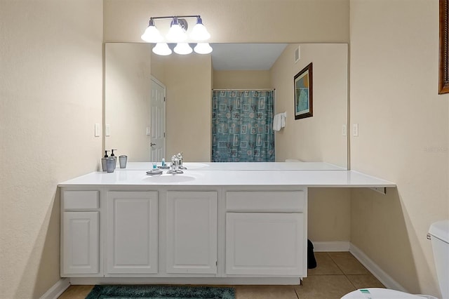 bathroom featuring tile patterned floors, toilet, baseboards, curtained shower, and vanity