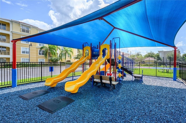 community jungle gym featuring fence