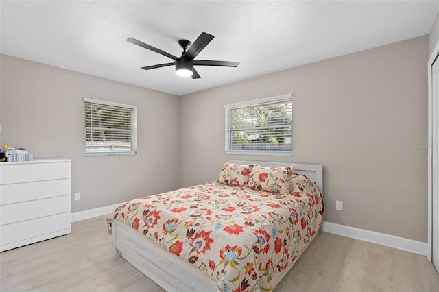 197 Flame Ave, Maitland, FL 32751 - bedroom featuring a ceiling fan, baseboards, and light wood-style floors