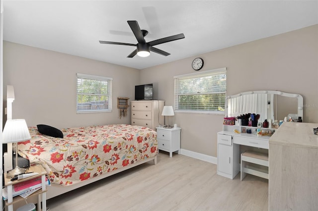 197 Flame Ave, Maitland, FL 32751 - bedroom featuring light wood-style floors, a ceiling fan, and baseboards