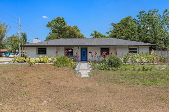 197 Flame Ave, Maitland, FL 32751 - ranch-style house with fence, a front yard, and stucco siding
