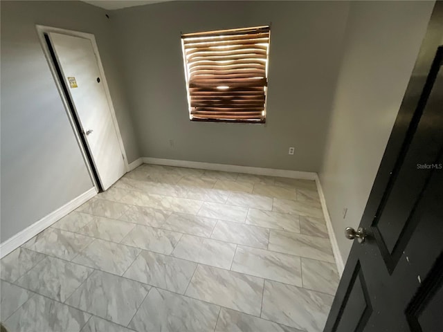 434 Diamond Acres Rd, Davenport, FL 33837 - empty room featuring marble finish floor and baseboards