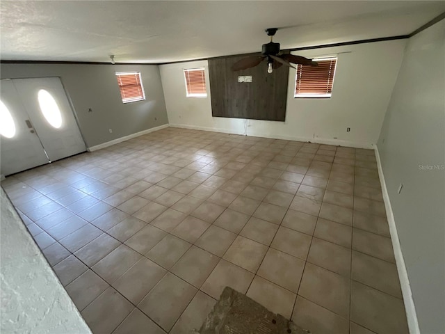 434 Diamond Acres Rd, Davenport, FL 33837 - interior space featuring tile patterned floors, baseboards, and ceiling fan