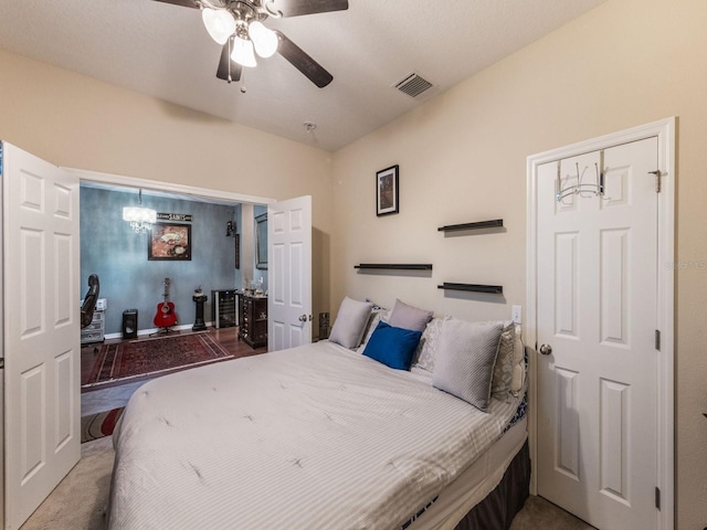 bedroom with visible vents and a ceiling fan
