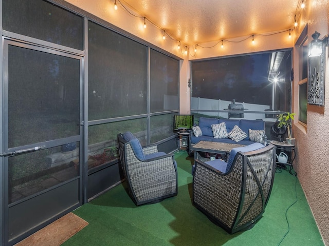sunroom / solarium featuring an outdoor hangout area