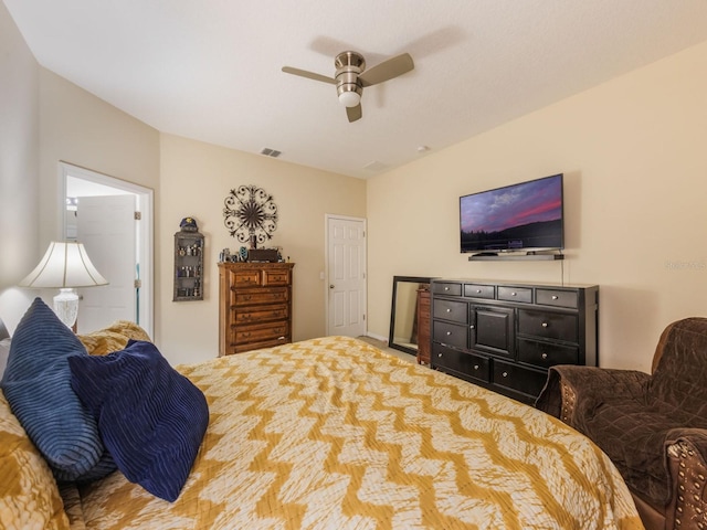 carpeted bedroom featuring visible vents and ceiling fan