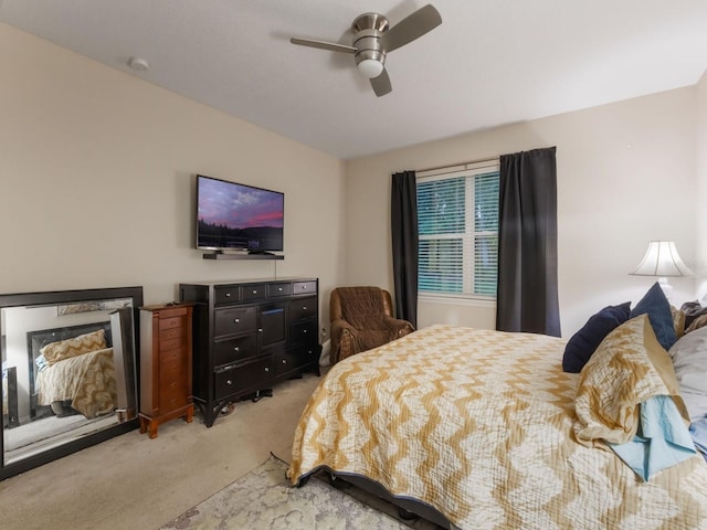 carpeted bedroom featuring a ceiling fan