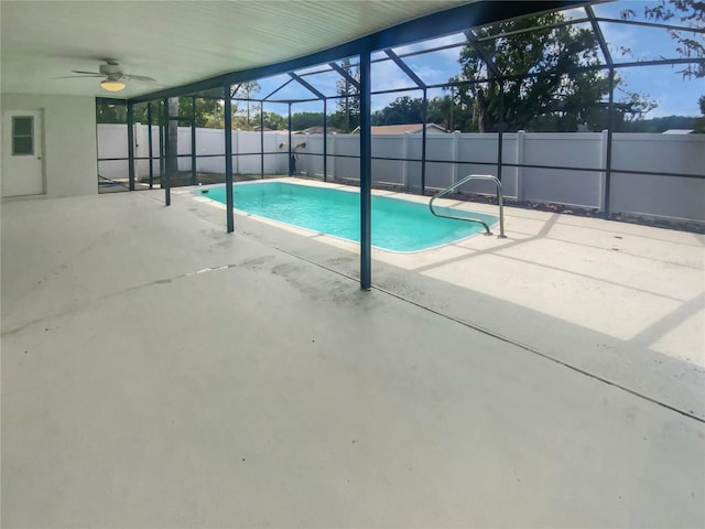 view of swimming pool with a fenced in pool, a fenced backyard, a lanai, a ceiling fan, and a patio area