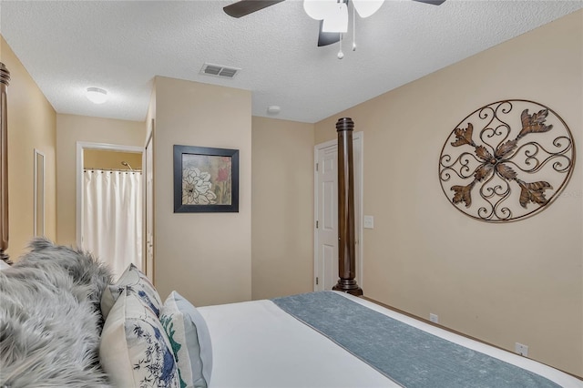 bedroom featuring a ceiling fan, a textured ceiling, and visible vents