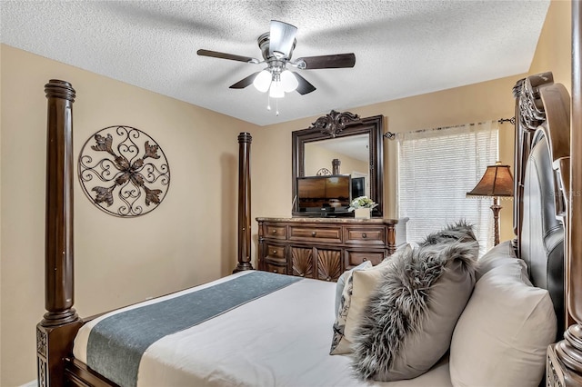 bedroom with a textured ceiling and a ceiling fan