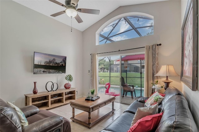 living room featuring high vaulted ceiling, ceiling fan, and light tile patterned floors