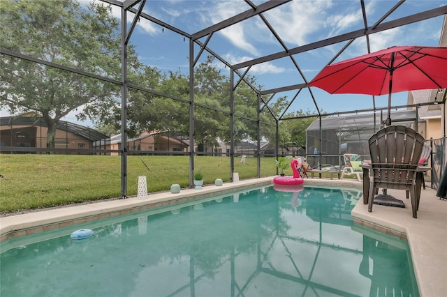 outdoor pool with glass enclosure, a yard, and a patio