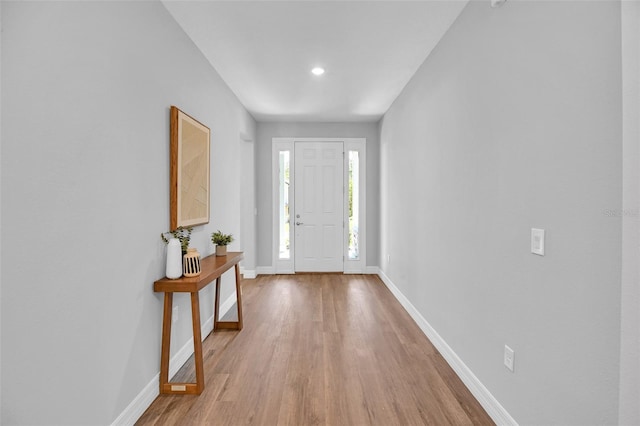 foyer entrance featuring recessed lighting, baseboards, and wood finished floors