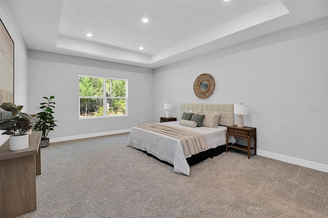 bedroom featuring a raised ceiling, carpet flooring, baseboards, and recessed lighting