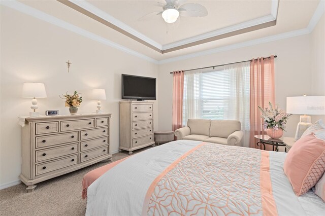 2530 Stargrass Cir, Clermont, FL 34715 - bedroom featuring ceiling fan, light carpet, crown molding, and a tray ceiling
