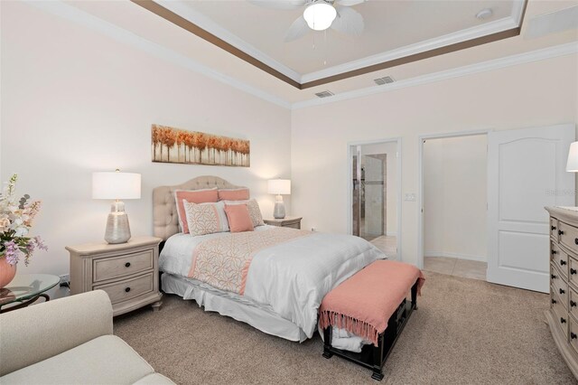 2530 Stargrass Cir, Clermont, FL 34715 - bedroom with visible vents, a tray ceiling, light colored carpet, and crown molding