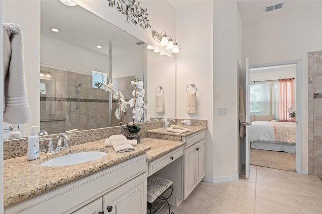 2530 Stargrass Cir, Clermont, FL 34715 - bathroom featuring a tile shower, visible vents, baseboards, and a sink