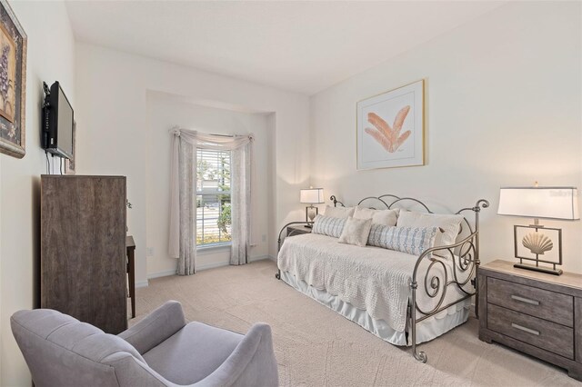2530 Stargrass Cir, Clermont, FL 34715 - bedroom featuring light carpet and baseboards