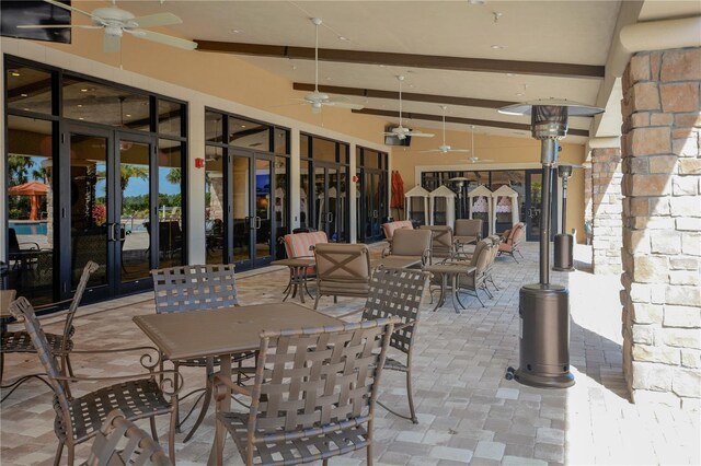 2530 Stargrass Cir, Clermont, FL 34715 - view of patio / terrace featuring french doors, outdoor dining space, and a ceiling fan