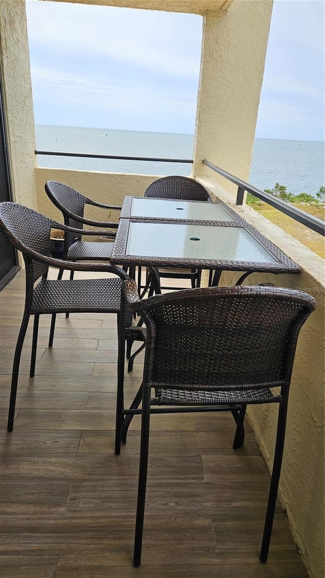 balcony featuring a water view