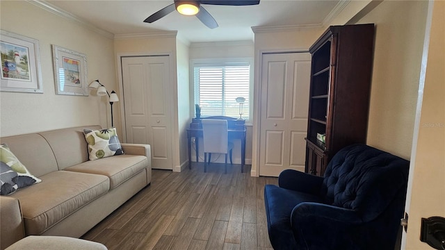 living area with ceiling fan, ornamental molding, and wood finished floors