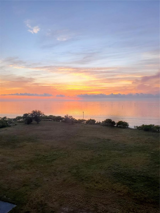 nature at dusk featuring a water view