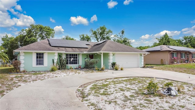 432 Taylorville St, Deltona, FL 32725 - ranch-style house featuring roof with shingles, solar panels, concrete driveway, an attached garage, and stucco siding