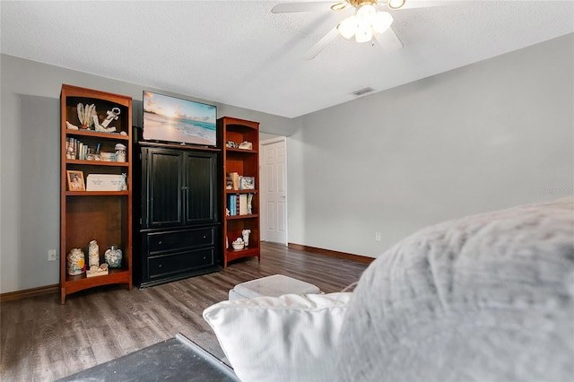 432 Taylorville St, Deltona, FL 32725 - bedroom with wood finished floors, visible vents, baseboards, a textured ceiling, and ceiling fan