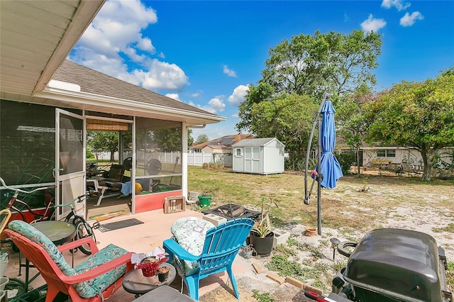 432 Taylorville St, Deltona, FL 32725 - view of patio / terrace with a storage shed, fence, a sunroom, and an outdoor structure