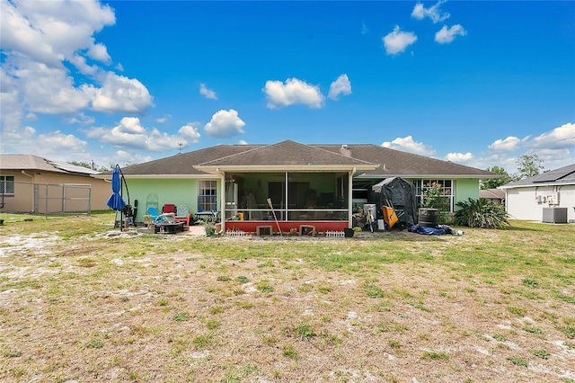 432 Taylorville St, Deltona, FL 32725 - back of property with fence, a sunroom, a yard, and cooling unit