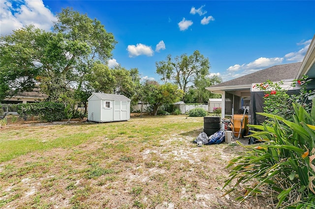 432 Taylorville St, Deltona, FL 32725 - view of yard featuring a sunroom, an outbuilding, a shed, and a fenced backyard