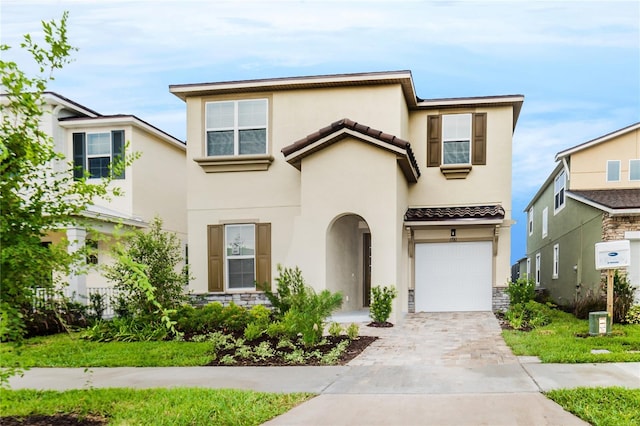 1781 Sawyer Palm Pl, Kissimmee, FL 34747 - traditional-style home featuring a tiled roof, central air condition unit, stucco siding, driveway, and a garage