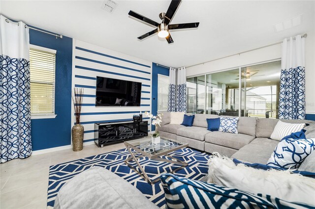 1781 Sawyer Palm Pl, Kissimmee, FL 34747 - tiled living area featuring baseboards, a ceiling fan, and visible vents