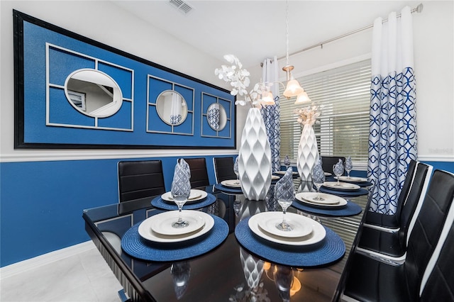 1781 Sawyer Palm Pl, Kissimmee, FL 34747 - dining room featuring tile patterned flooring, baseboards, visible vents, and an inviting chandelier